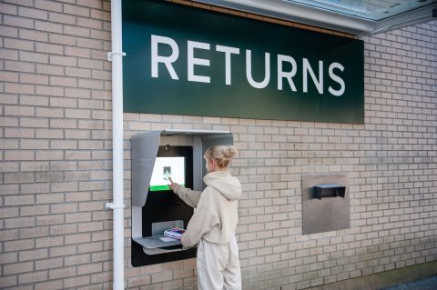 Person returning a book at the external book return